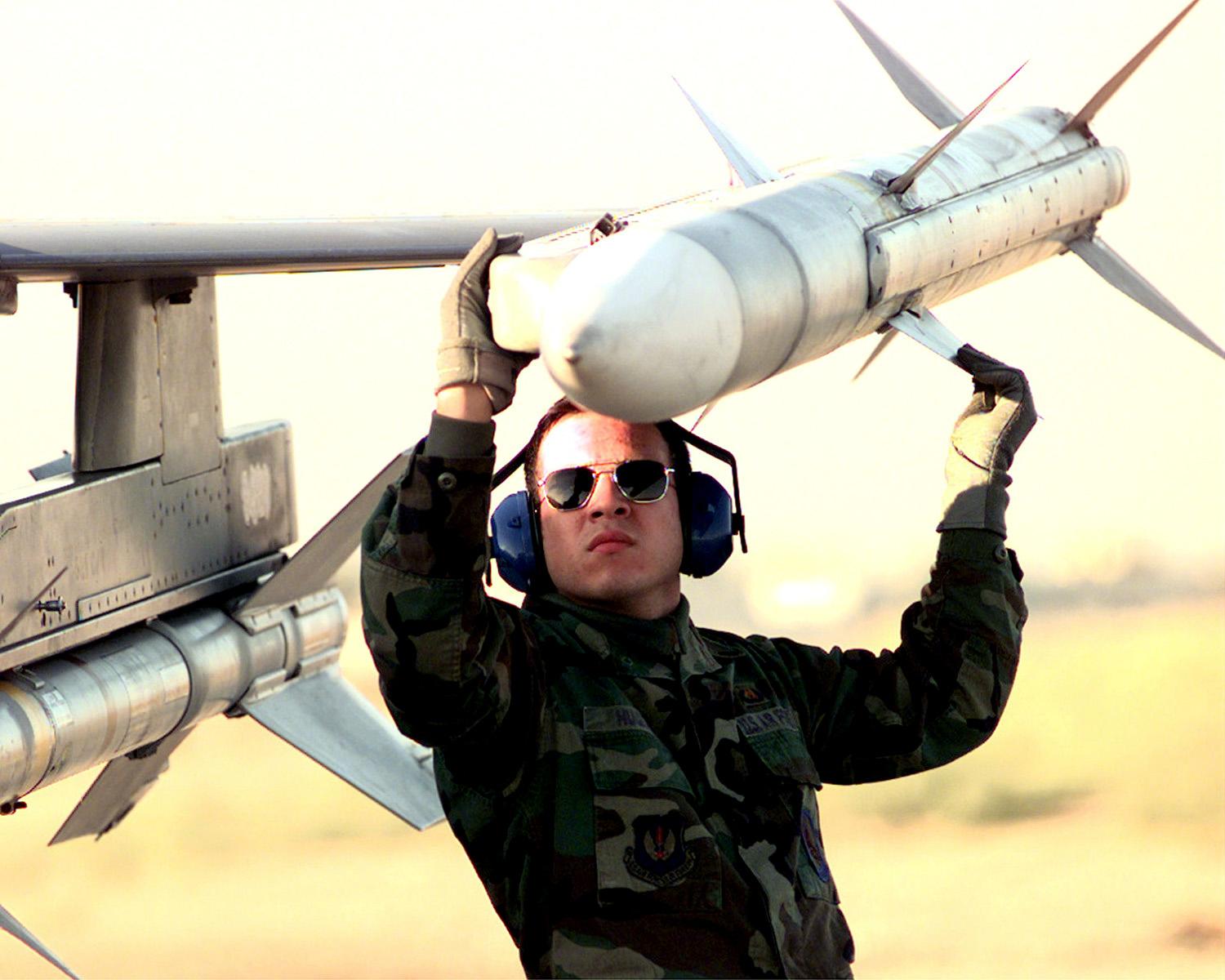 AIM-120 AMRAAM being loaded onto F-16