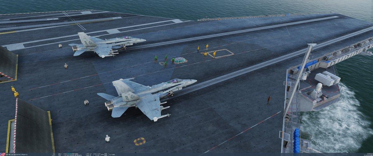 Overhead view of the carrier flight deck with multiple aircraft