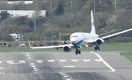 An airliner on short final in a crosswind, crabbing into the wind before touchdown