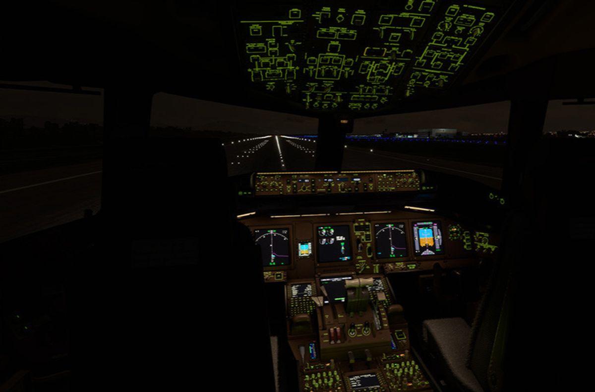 PMDG 777-300ER cockpit at night with overhead panel and displays fully illuminated on the taxiway